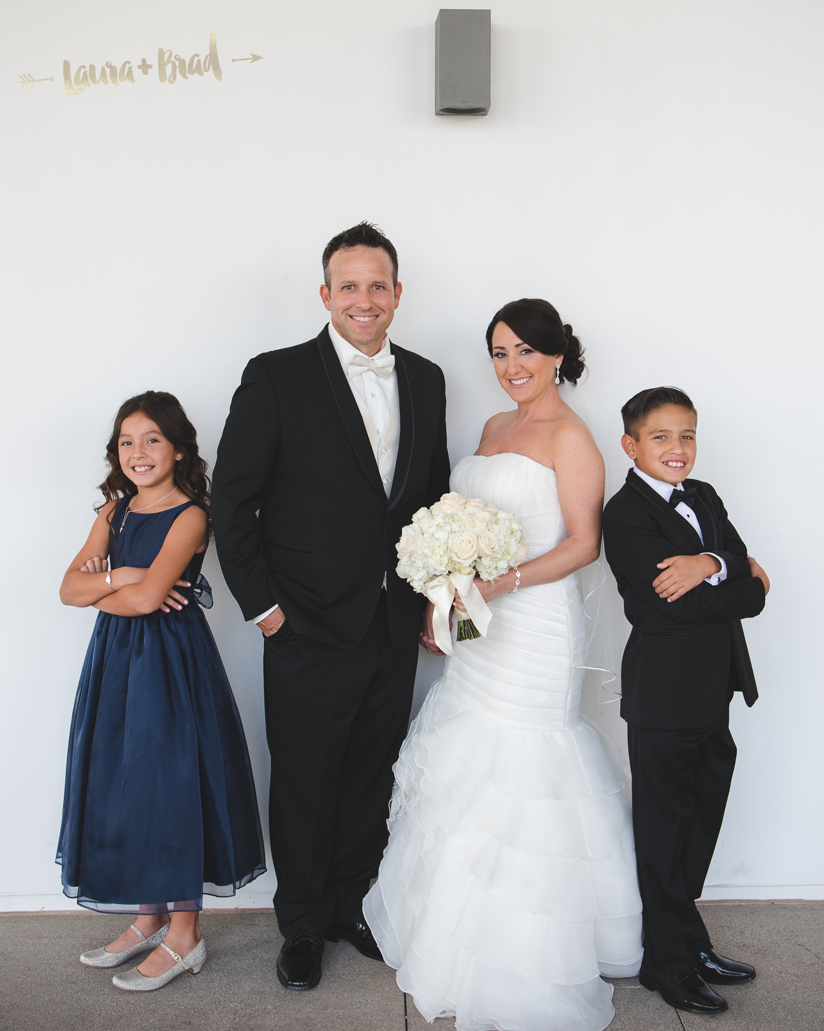 Bride and groom wedding day family photo fun