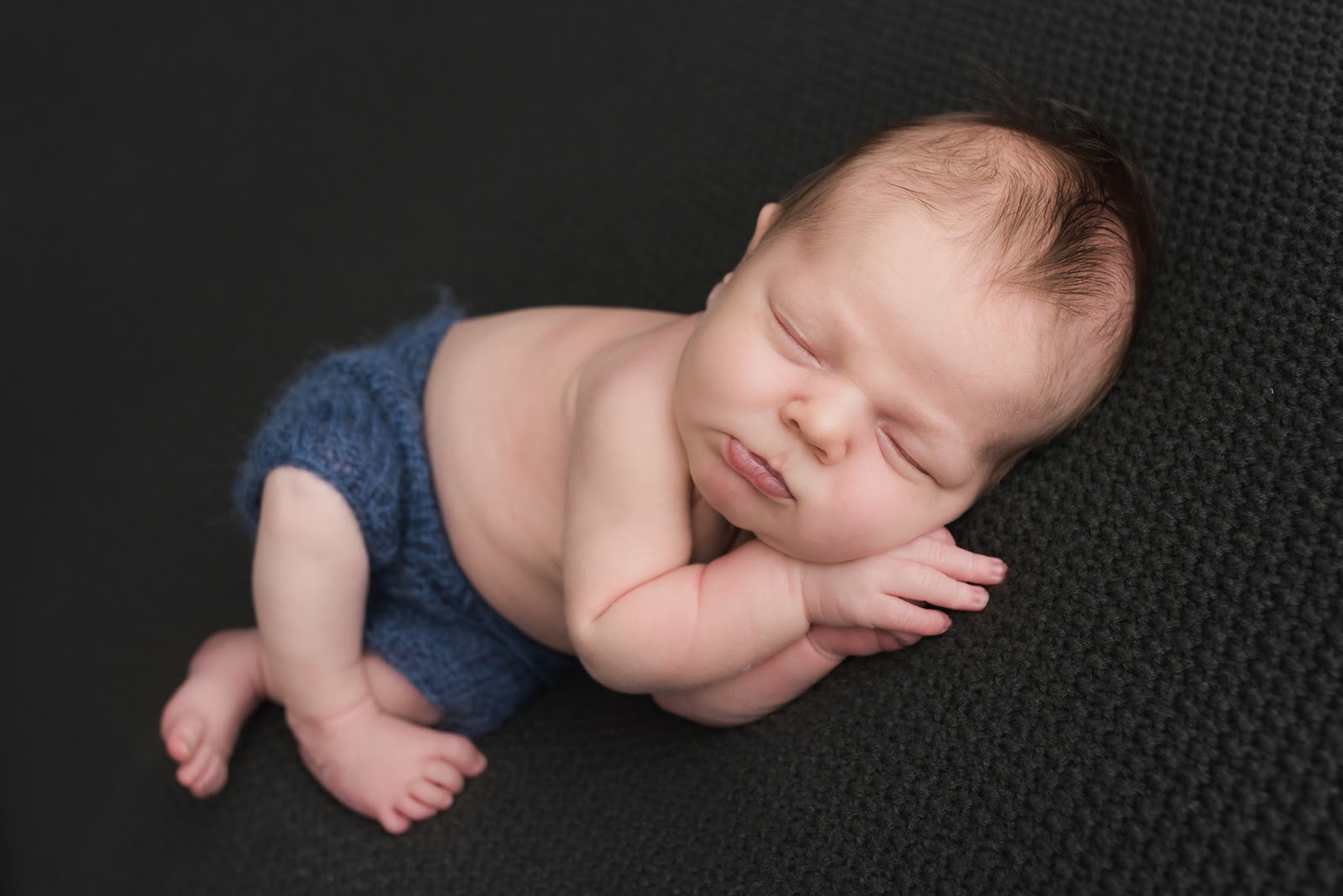 Orange County Newborn Photographer Laura Rauch with sleeping newborn baby