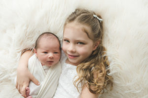 Newborn Hug and Sibling Photo